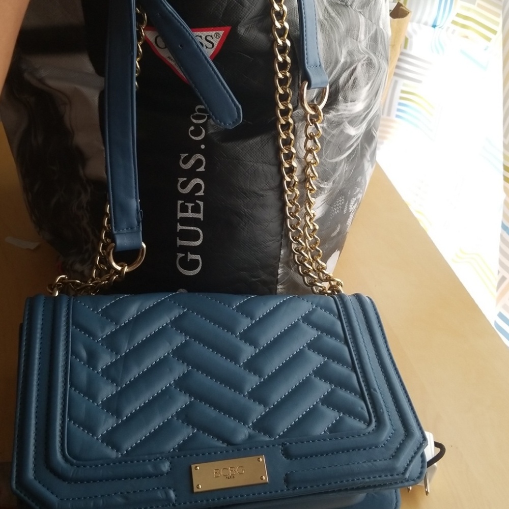 Beautiful blue BEBE crossbody bag.
